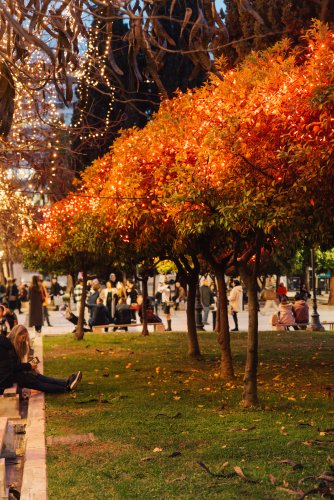 People passing by a decorated square