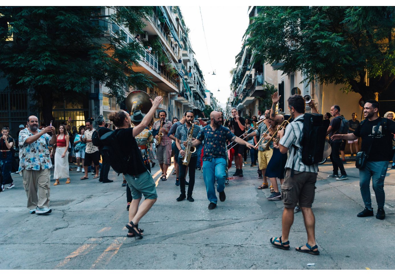 people playing music and dancing at the street