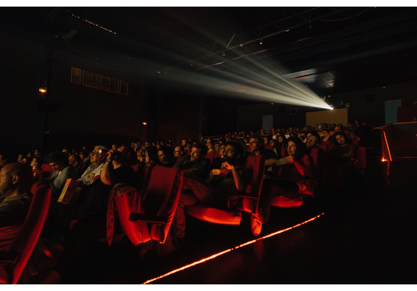 people watching a movie at a movie theatre